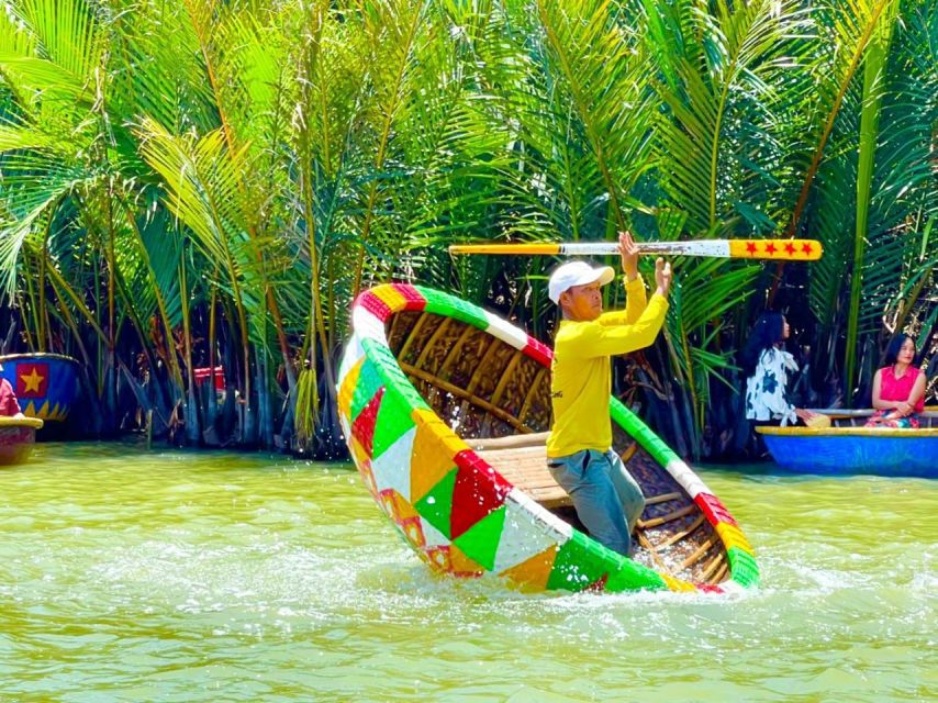 Local guide spinning a bamboo basket boat in Bay Mau Coconut Forest on the best coconut boat tour in Cam Thanh Village, Hội An, showcasing eco-adventure.